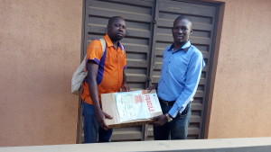 Dayo adetiloye receiving His Laptop from h2i